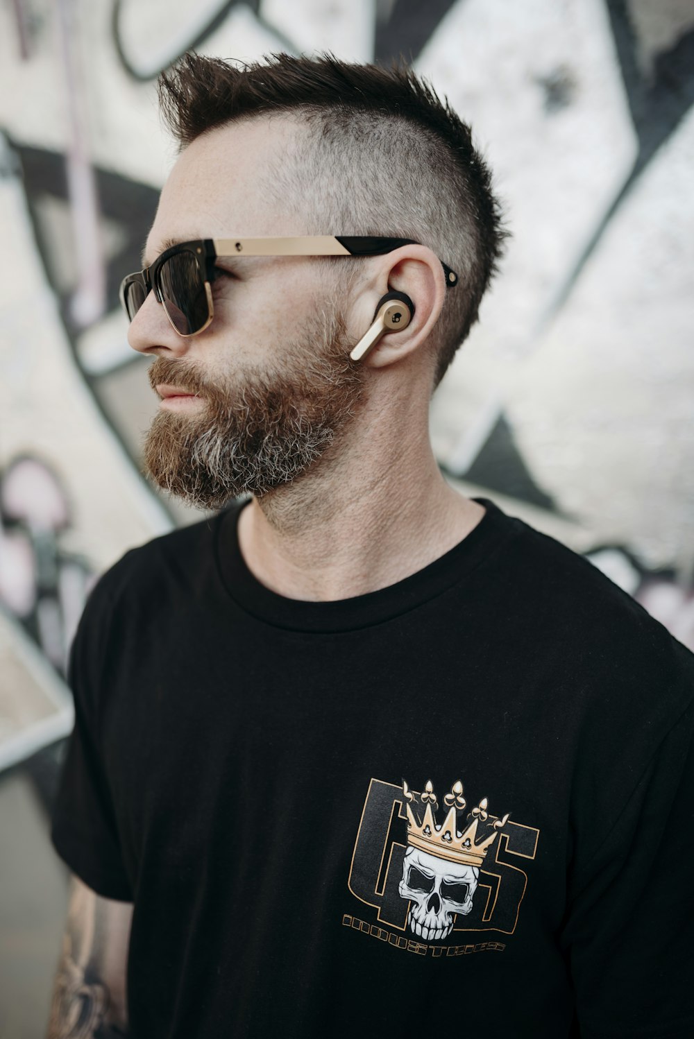 man in sunglasses and black crew-neck t-shirt