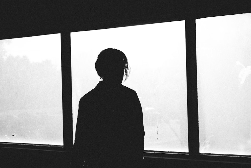 silhouette of man near the window