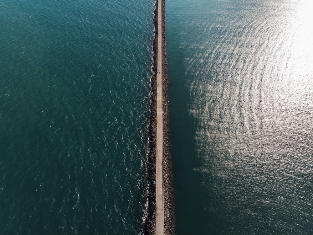 straight road between body of water