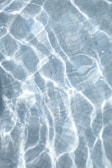 Close-up of water ripples reflecting soft light in the pool.