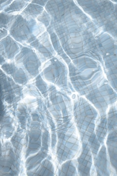 Close-up of a sparkling pool surface with a smooth transition to the deeper end.