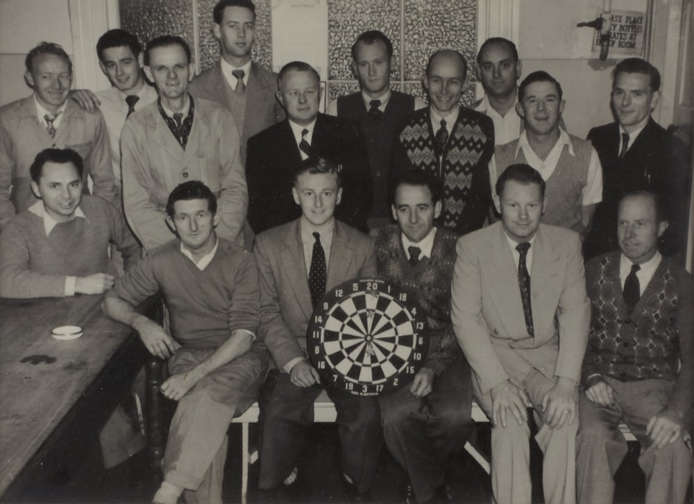 person holding dartboard