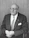 man wearing suit jacket and eyeglasses