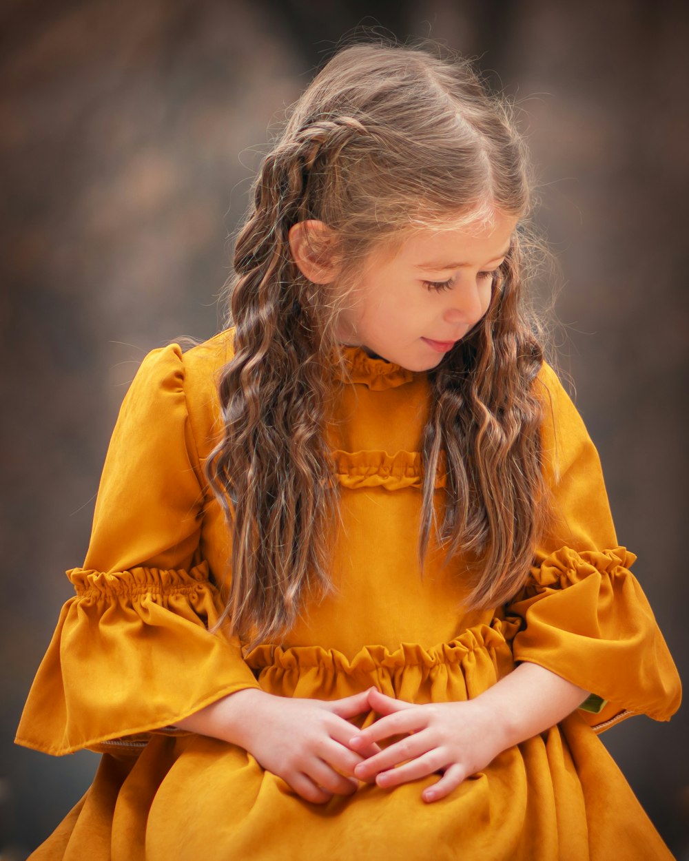 selective-focus photograph of girl in brown dress