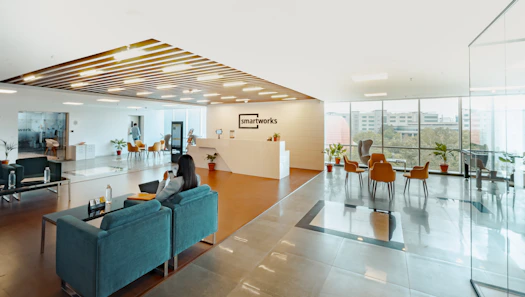 unknown person sitting on blue couch