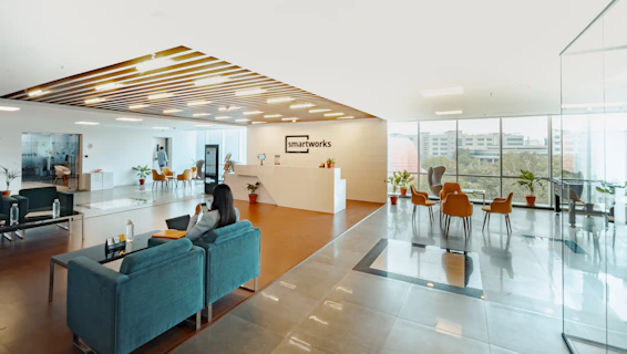 unknown person sitting on blue couch