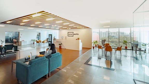 unknown person sitting on blue couch