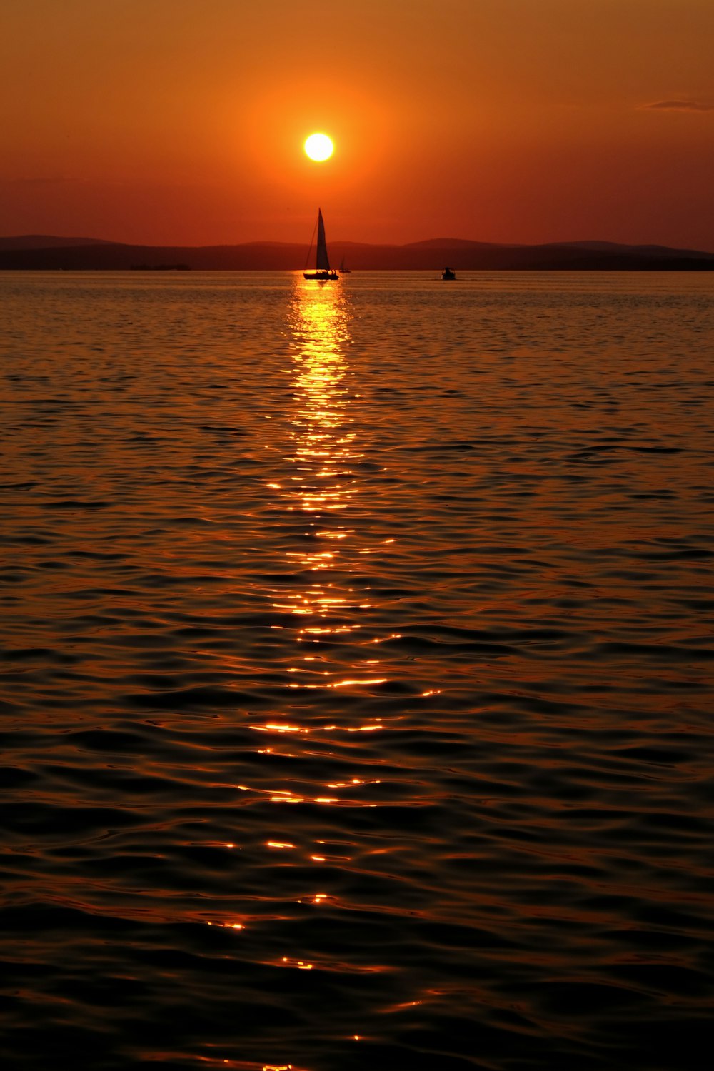 boat on sea during sunset