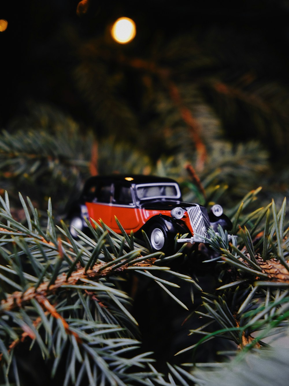 shallow focus photography of black and orange vintage car