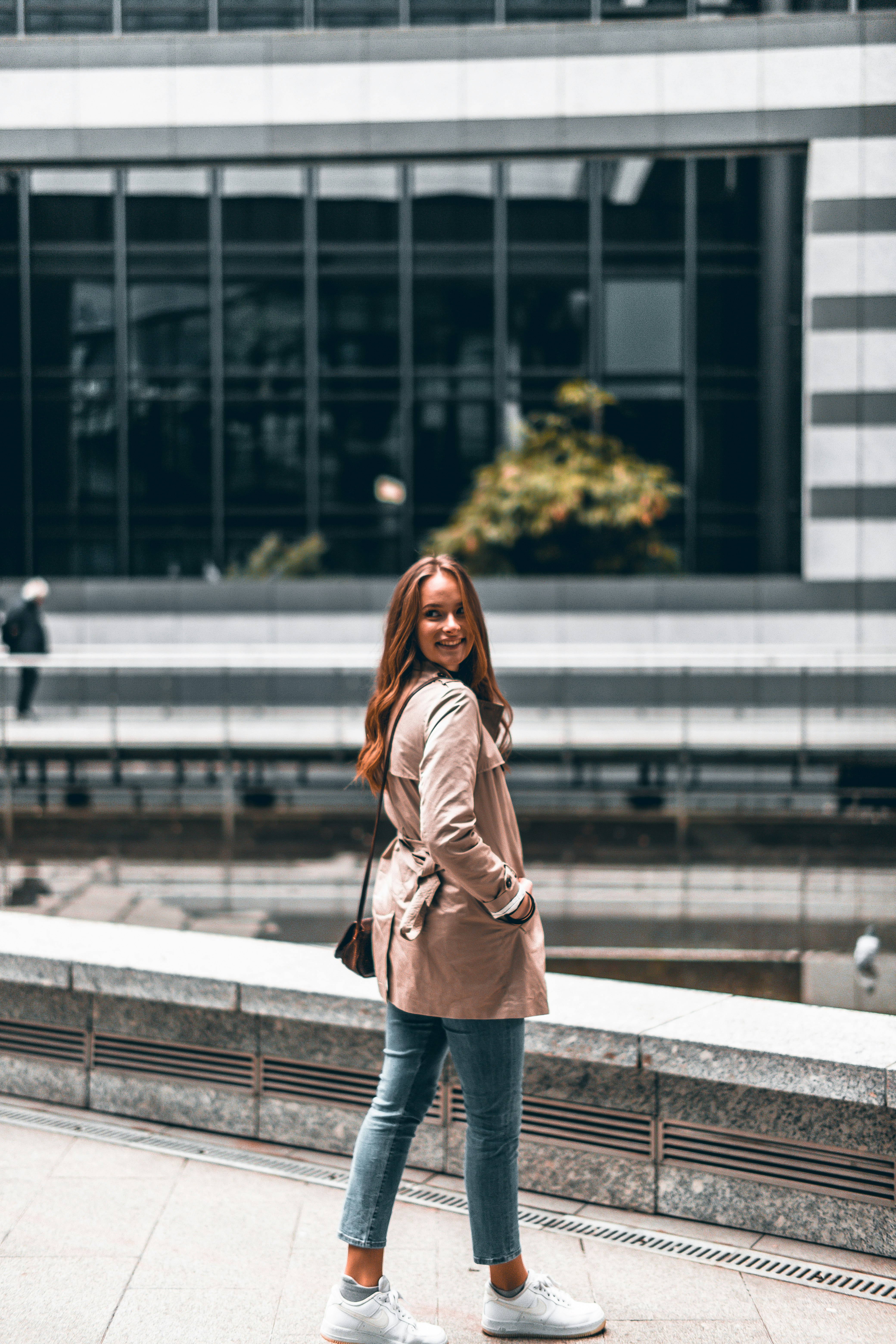 woman wearing brown coat screenshot