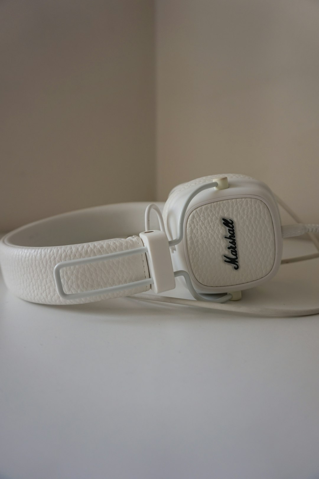 white corded over-ear headphones