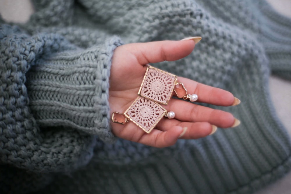 pair of gold-colored earrings