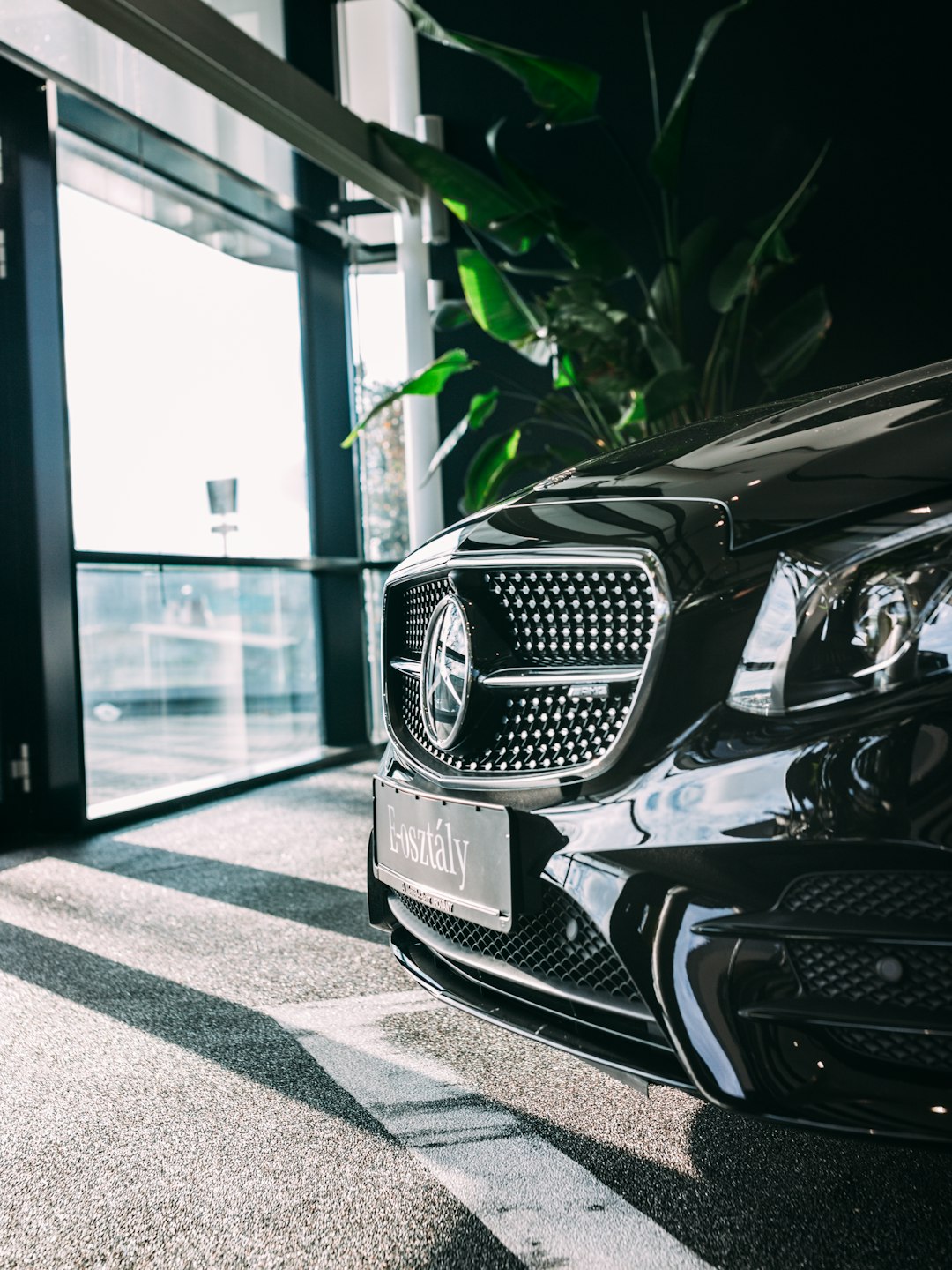 black passenger vehicle inside car shop