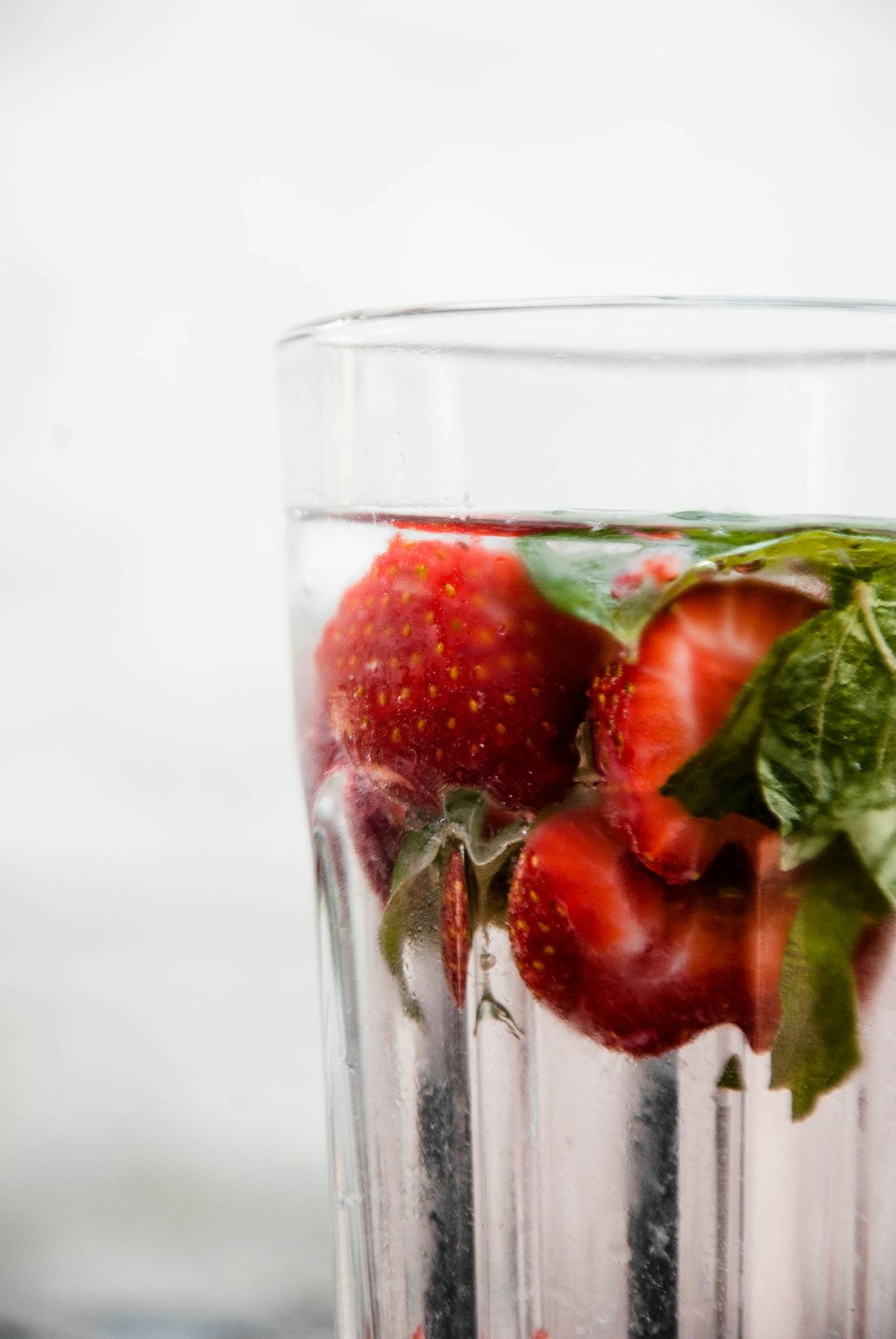 glass of water with strawberries