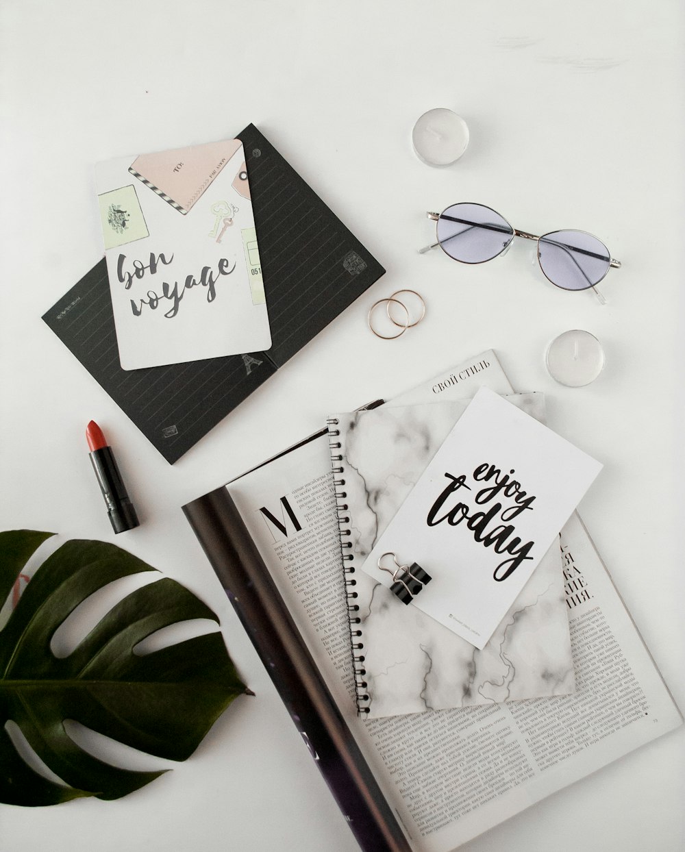 notebooks and eyeglasses on table