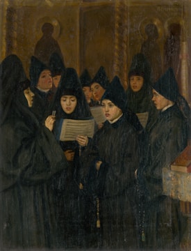 A group of women dressed in black religious garments stand together, holding and looking at hymn sheets. The background shows a dimly lit room with religious iconography.