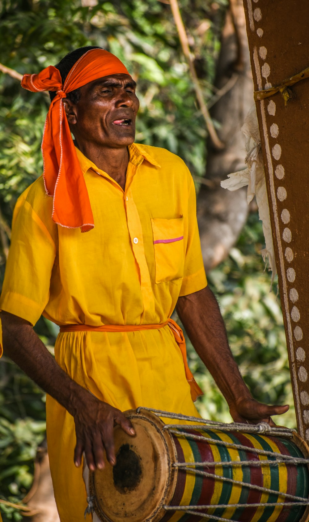 man playing percussion instrument