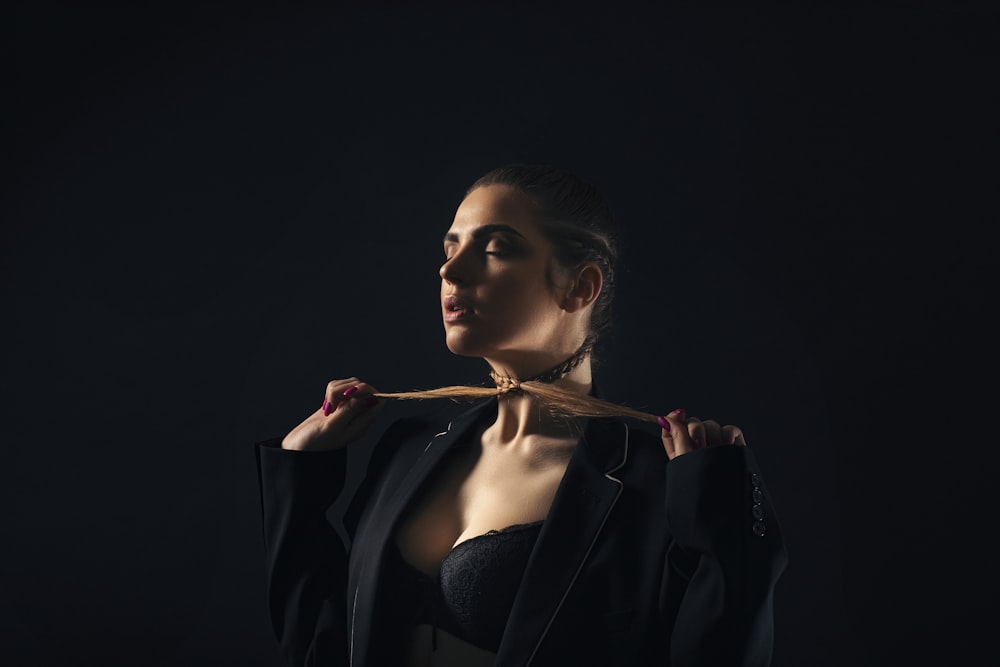 woman wearing black notched-lapel suit jacket