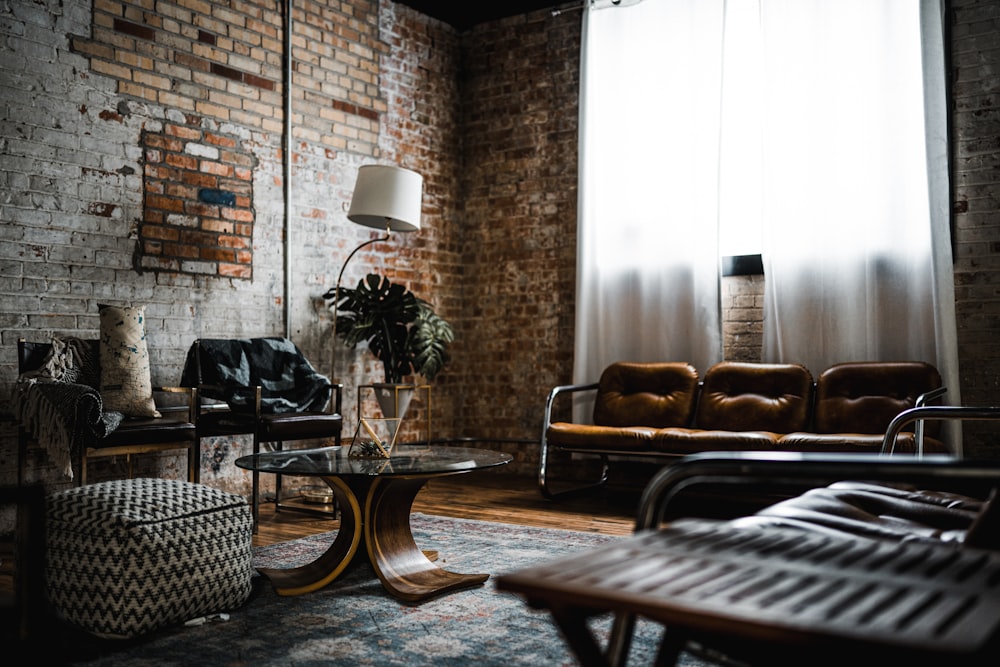 table lamp beside brick wall