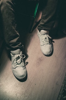 pair of white lace-up shoes