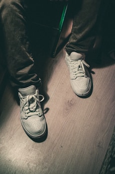 pair of white lace-up shoes