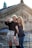 A couple taking a selfie in front of a historic Jaipur monument.