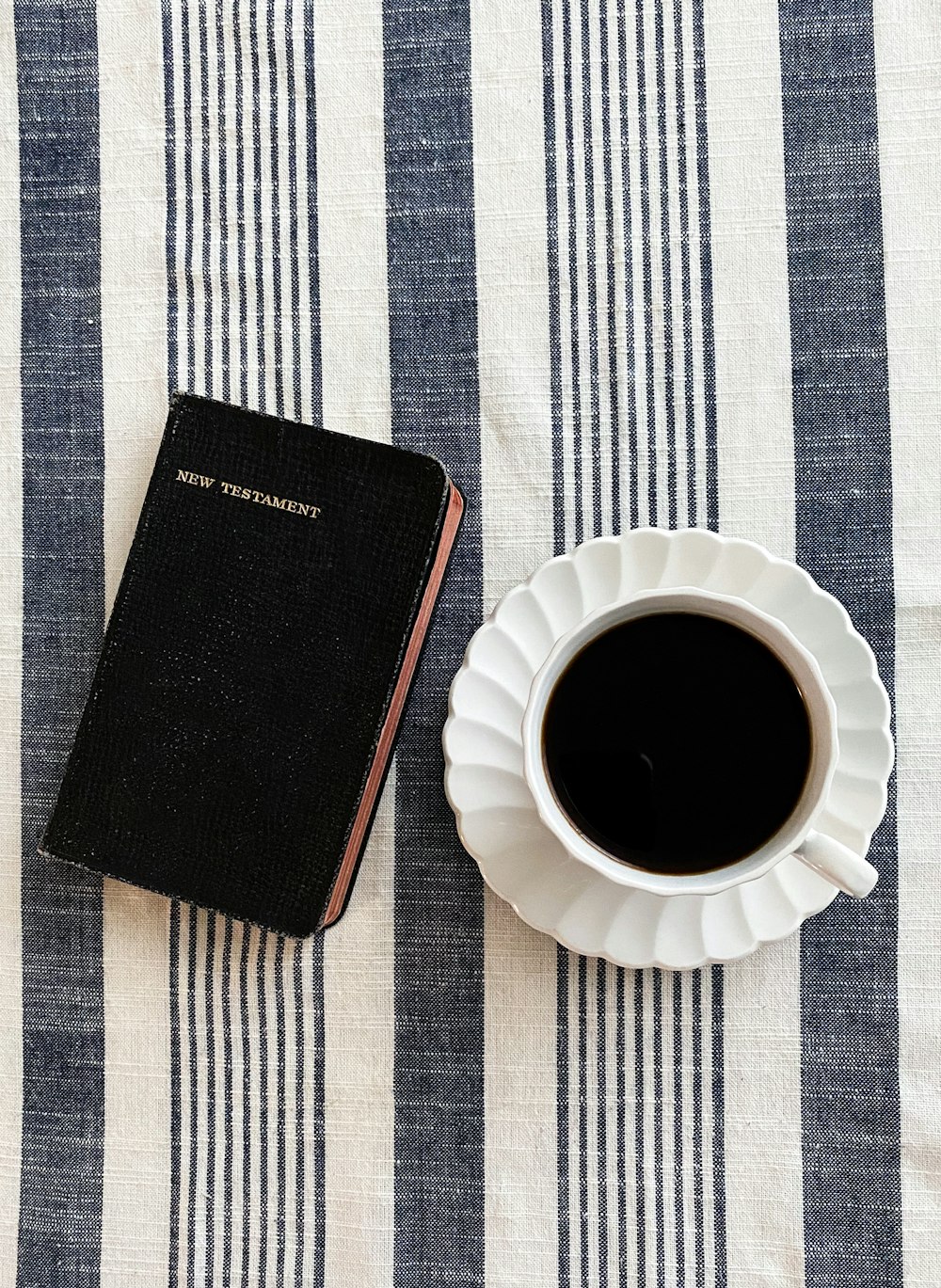 cup of black coffee on saucer