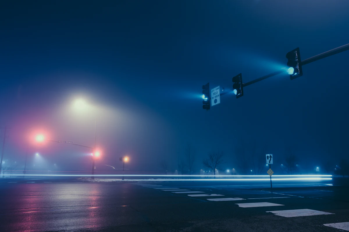 Traffic signals in blue fog