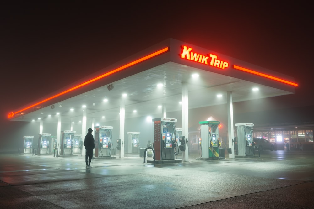 person standing near Kwik Trip gas station
