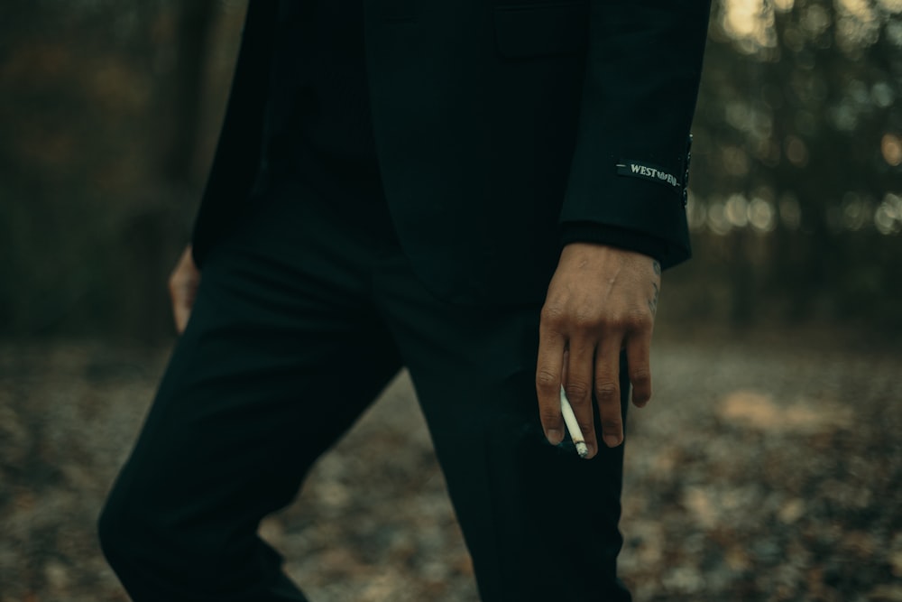 selective focus photography of man using cigarette