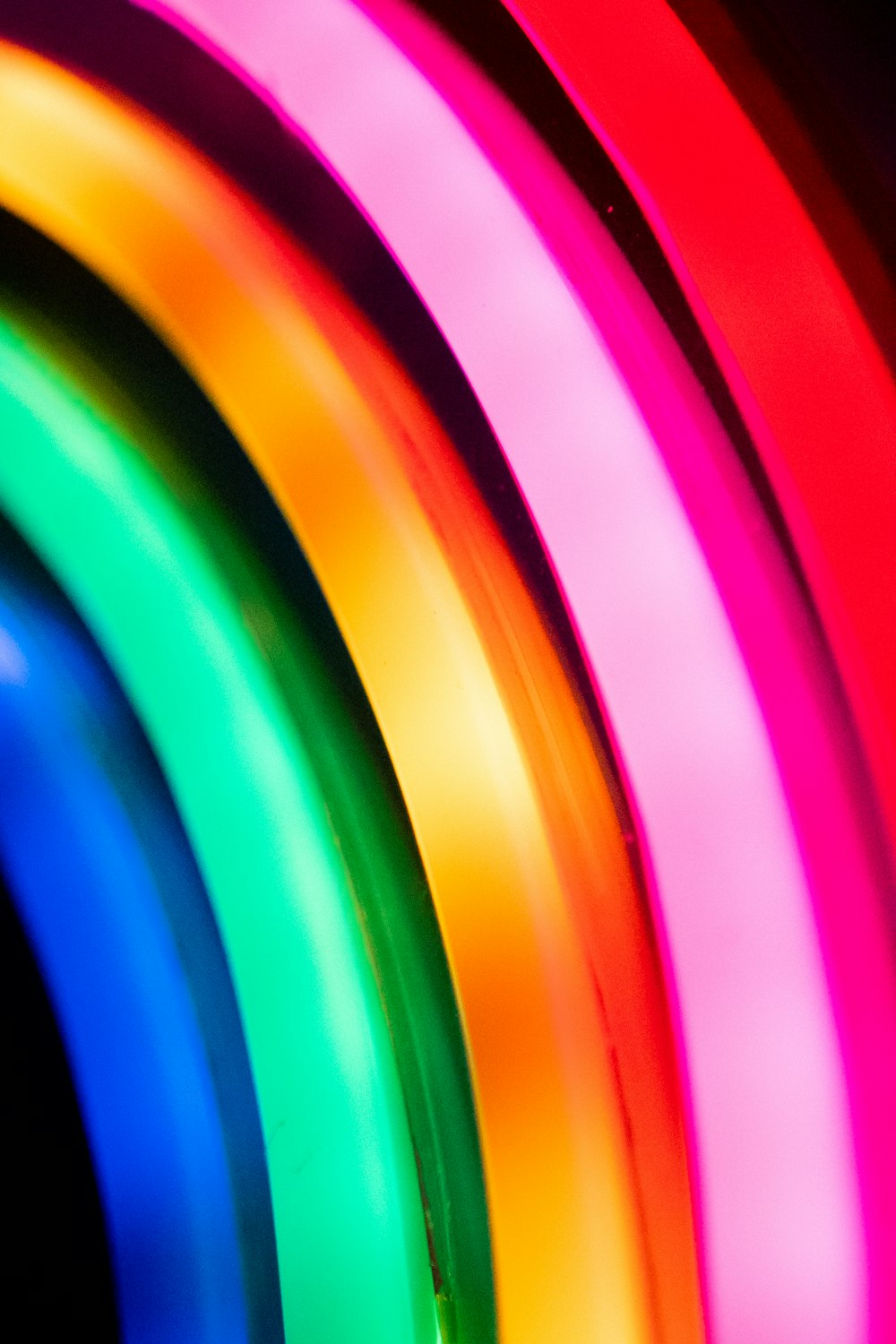 a close up of a neon colored tube