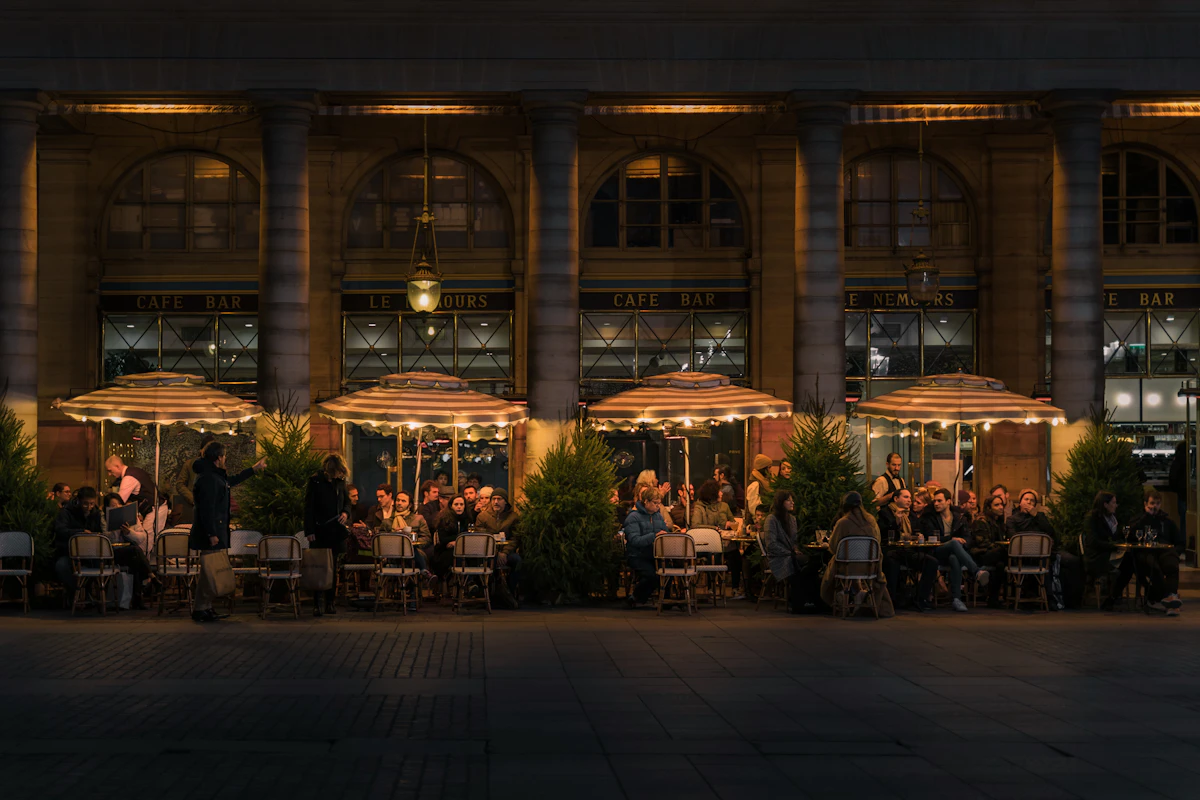 Elegant Japanese restaurant interior with dramatic lighting, dark wood and ambient glow — upscale date night Dubai