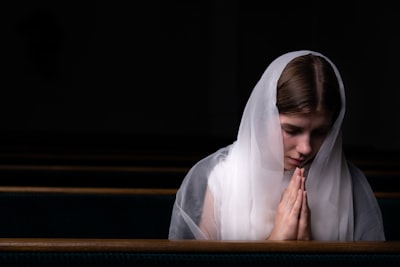 woman wearing white scarf religion google meet background