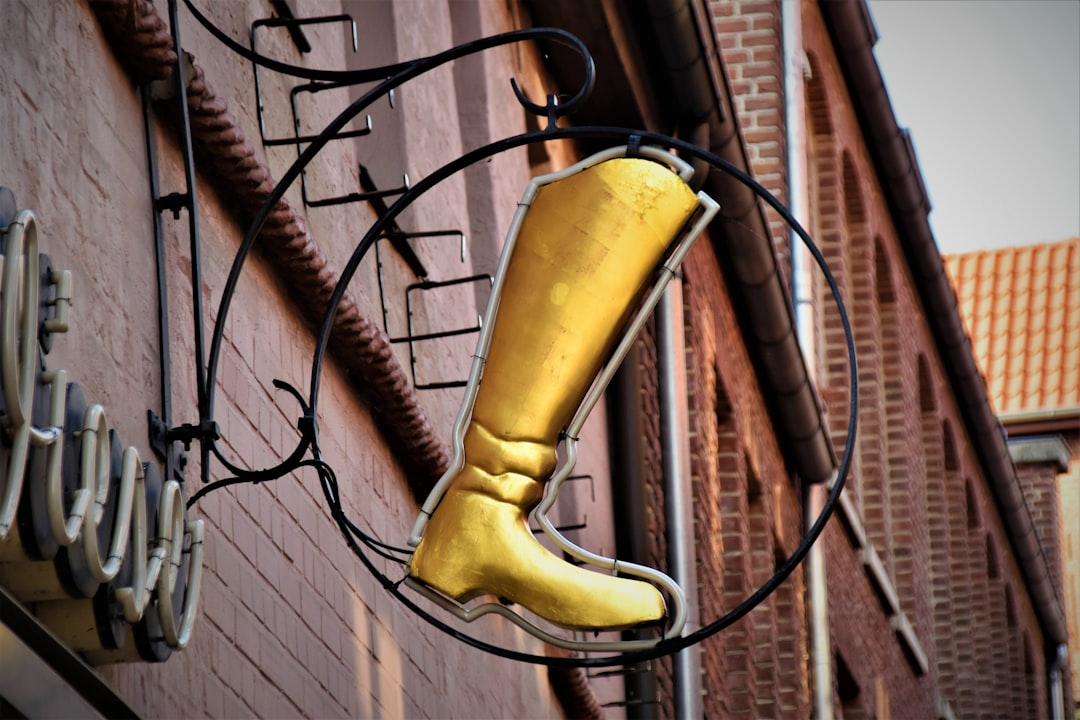 gold boot LED sign outside building