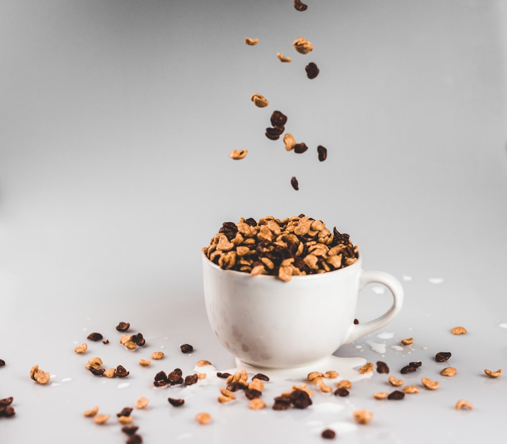 white ceramic mug on white surface