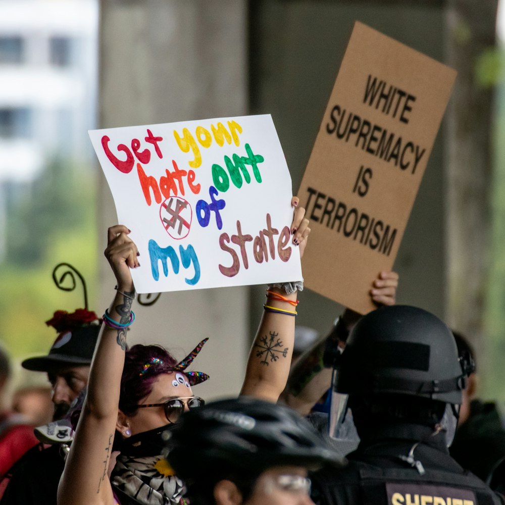 several people holding cardboards