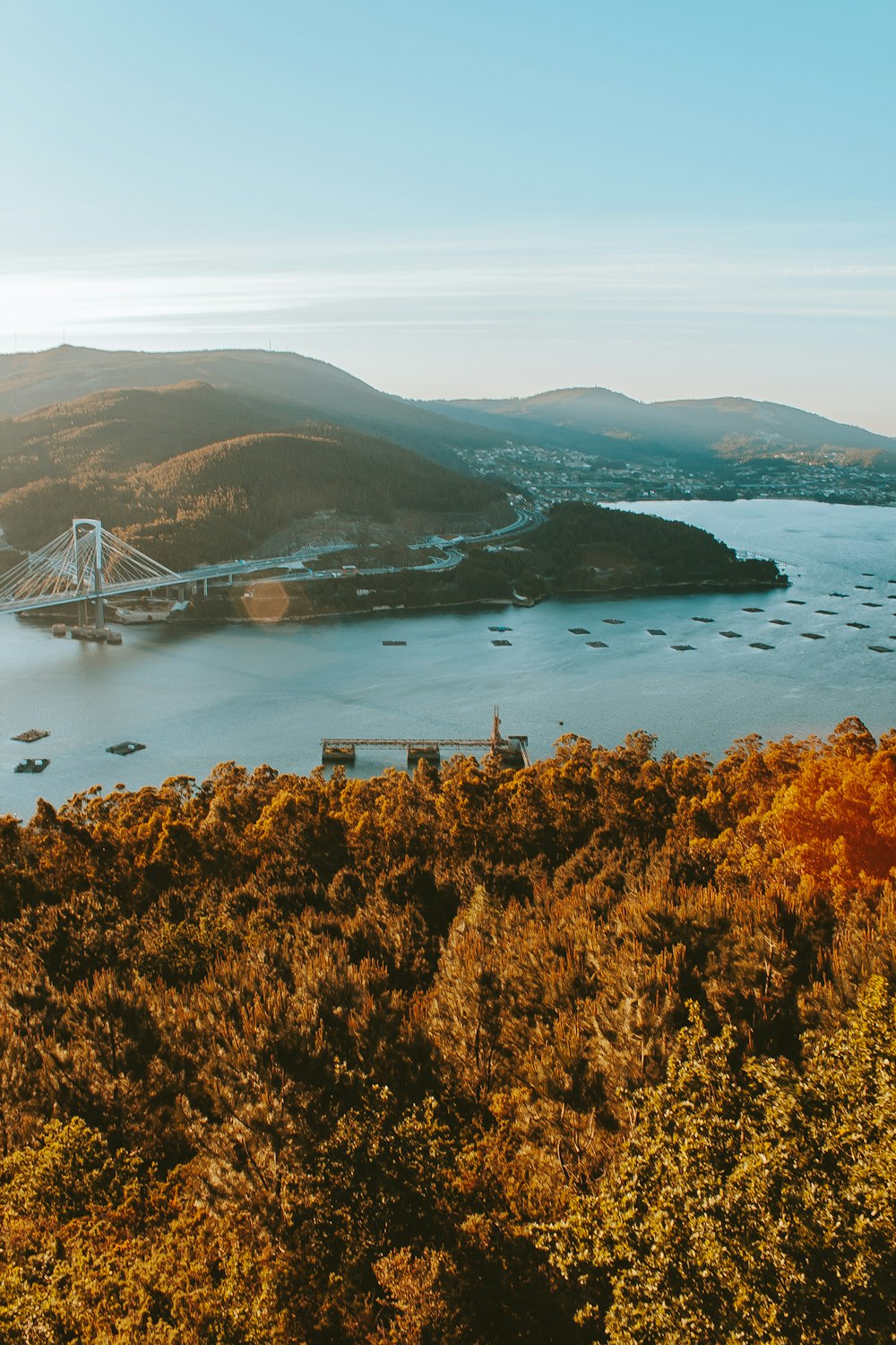 gray concrete suspension bridge over river