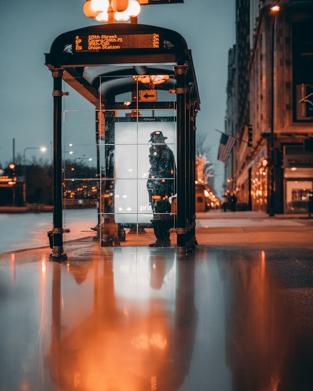 person standing inside telephone booth
