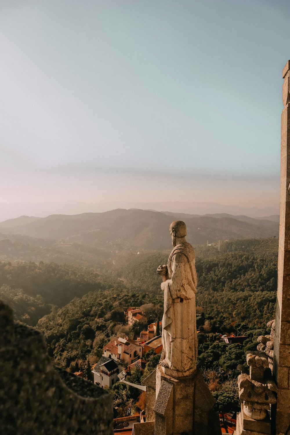 man statue on hill