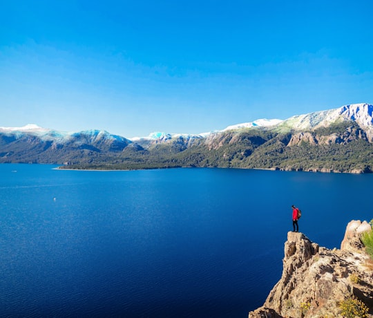 person standing on cliff in Parque Nacional Nahuel Huapi Argentina