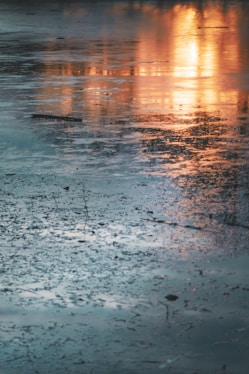 sunset reflection on body of water