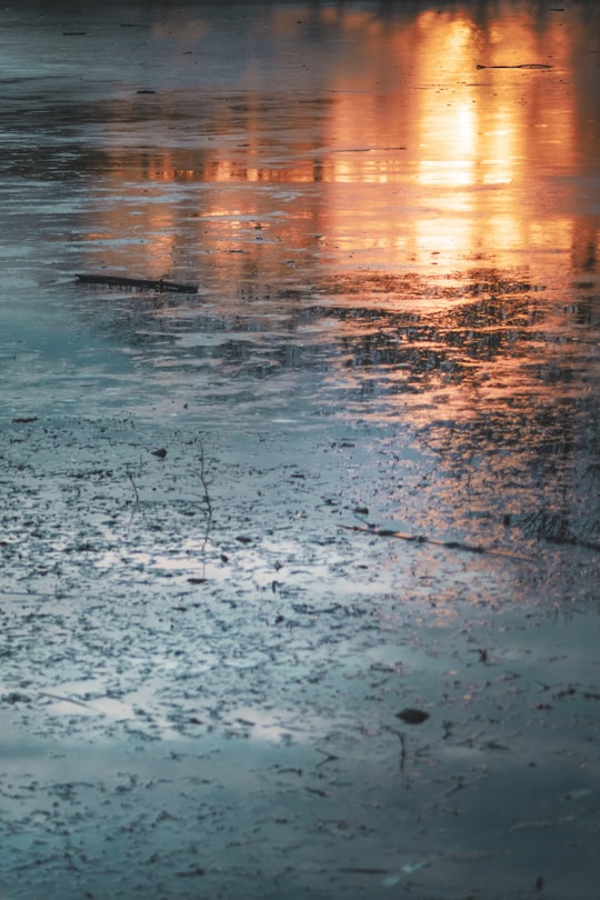 sunset reflection on body of water in München Germany