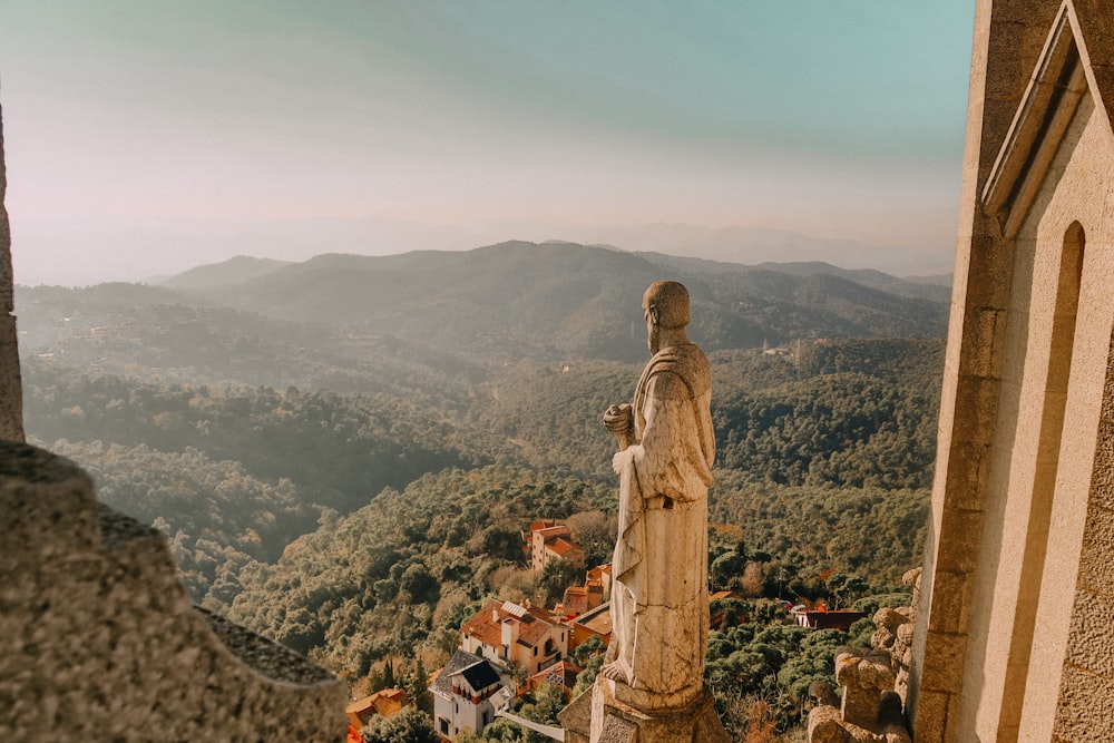 photography of human statue during daytime