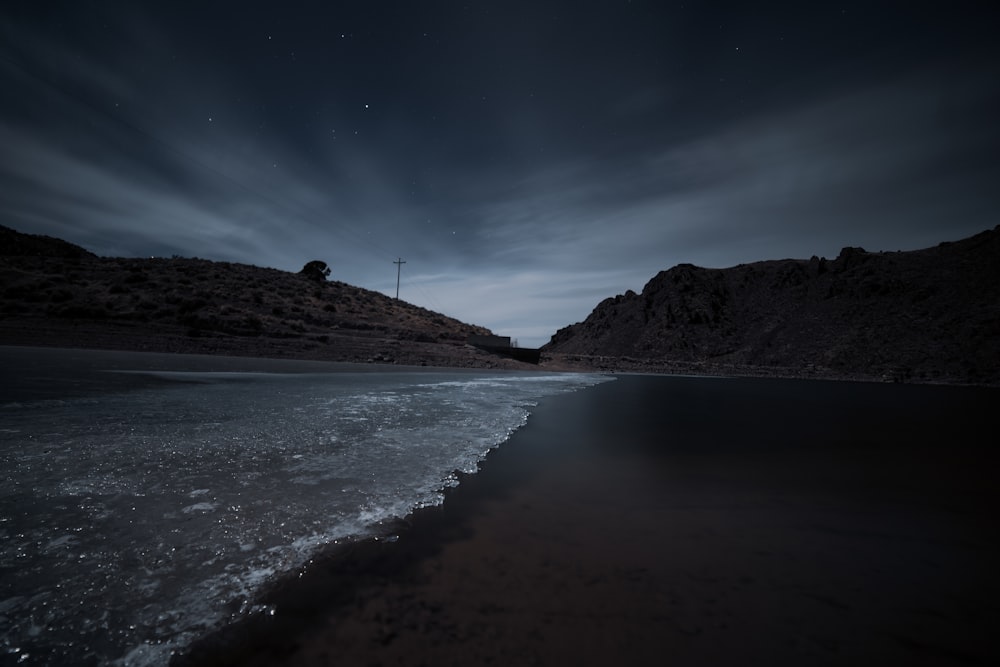 beach line under black sky