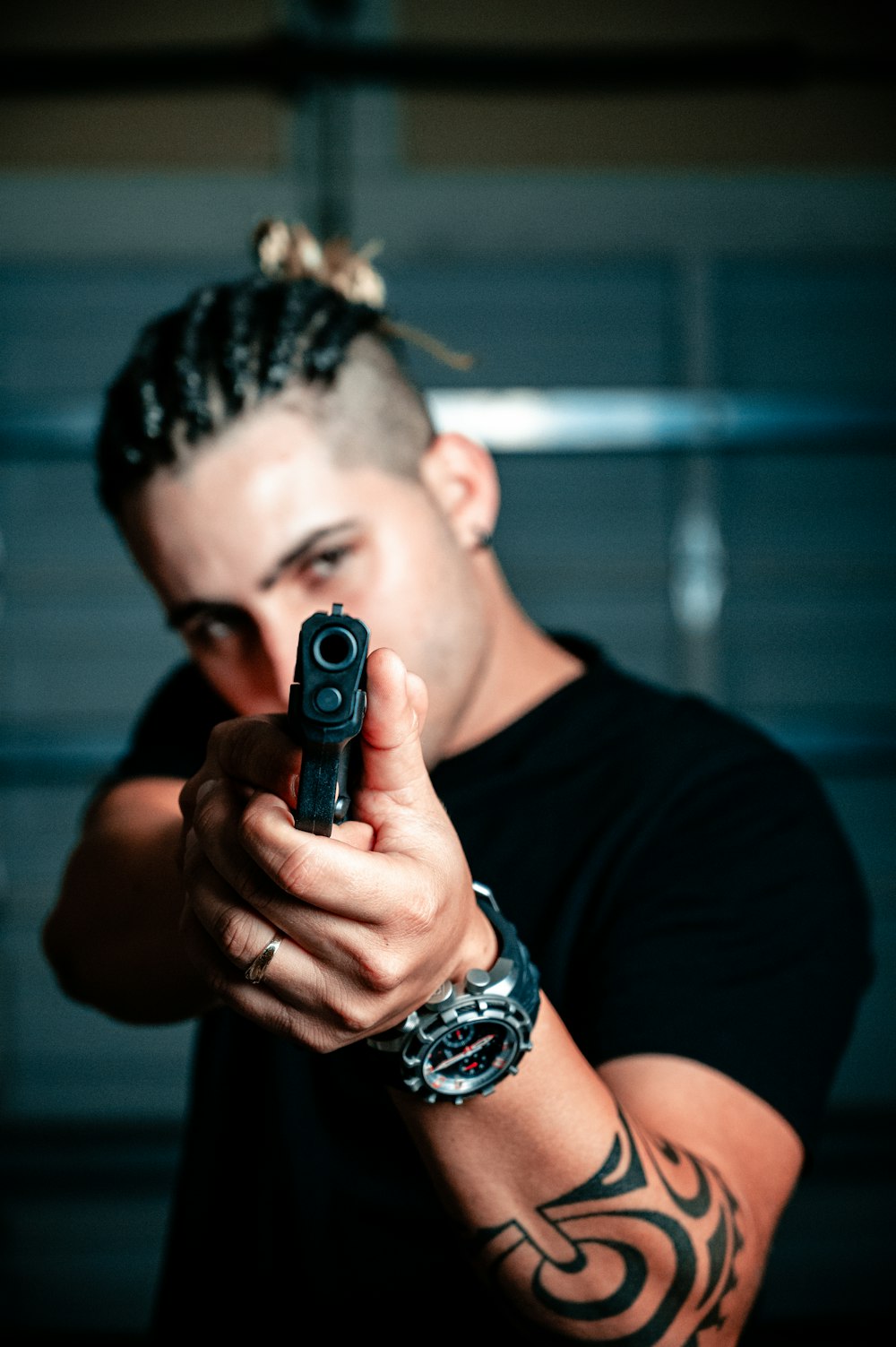 man aiming gun photo