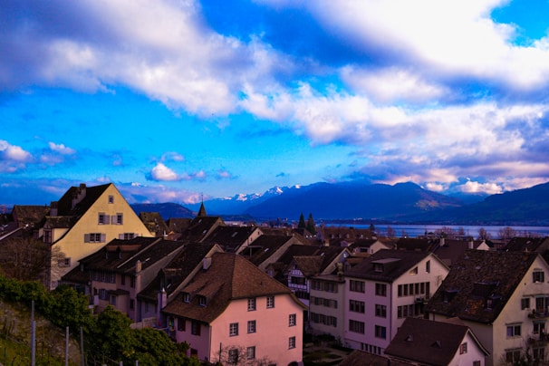 Snow-capped mountains surrounding the peaceful cityscape of Geneva.