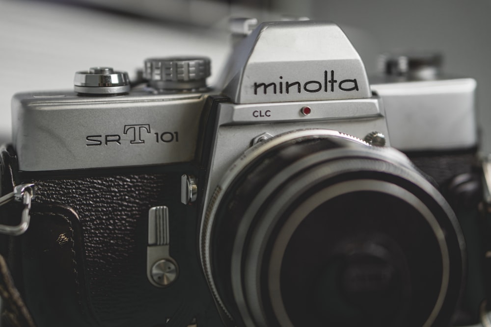 grayscale photo of Minolta SRT 101 DSLR camera
