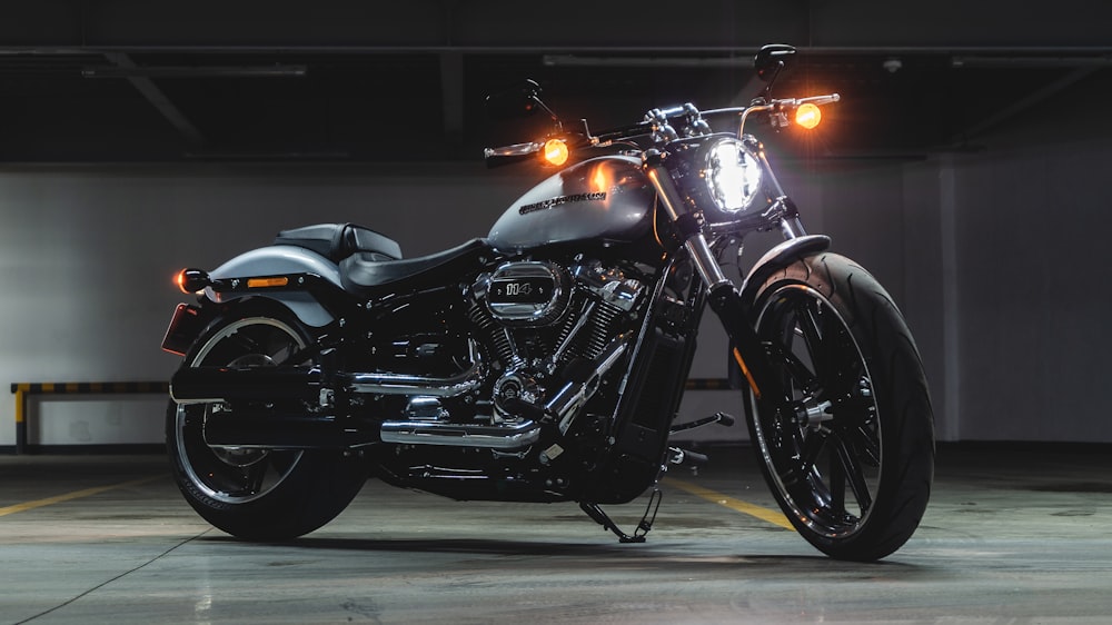 black and gray cruiser motorcycle on parking lot