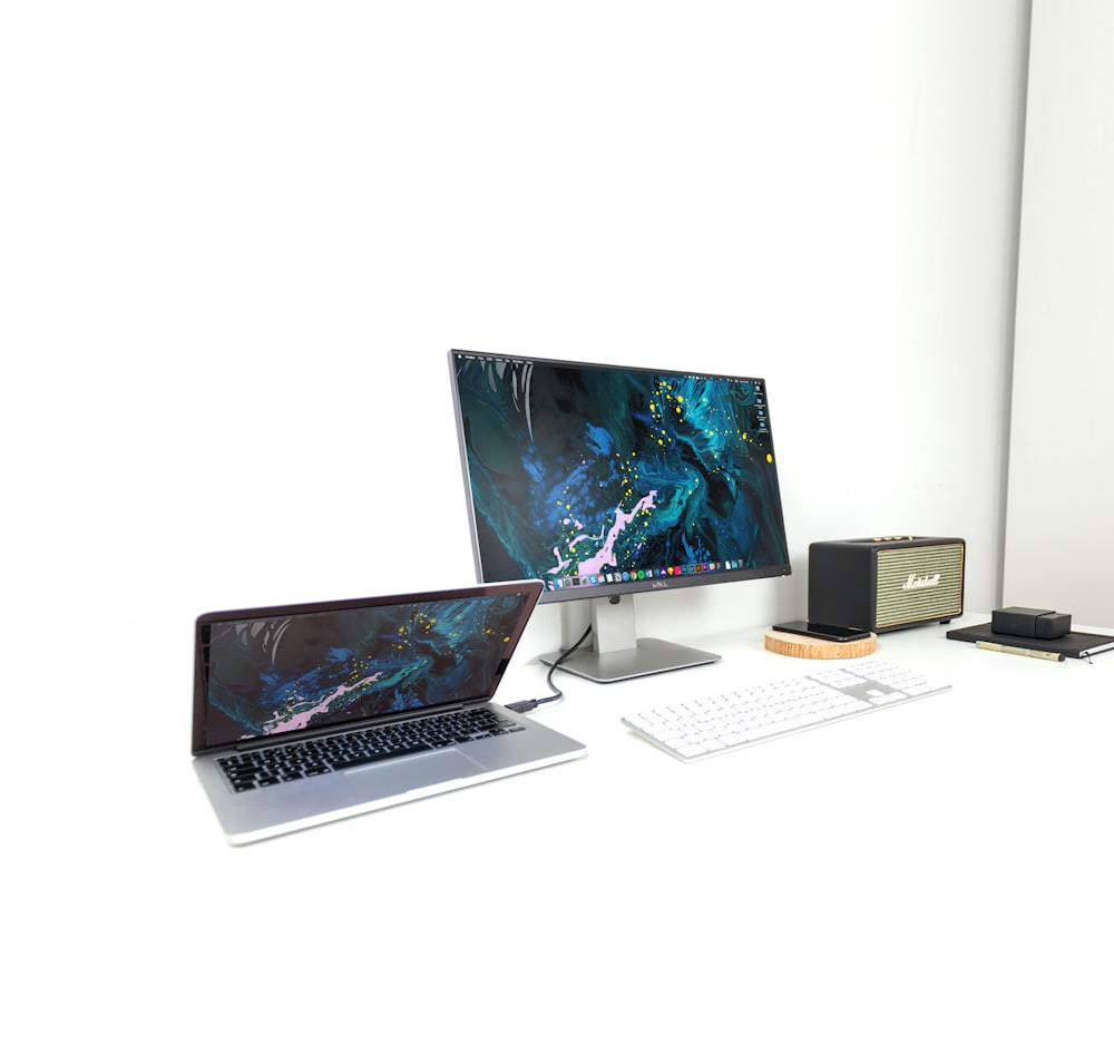 MacBook Pro and iMac on desk