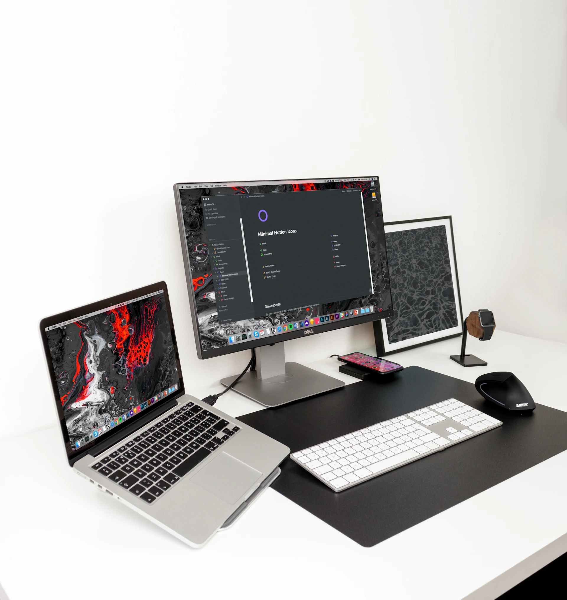 black and gray flat screen monitor with MacBook Pro and white keyboard